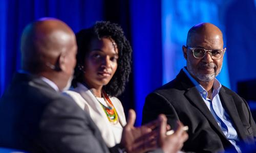 Photo of Shawn Turner, Dr Brook Dennard Rosser, and Juan Johnson on stage having a discussion