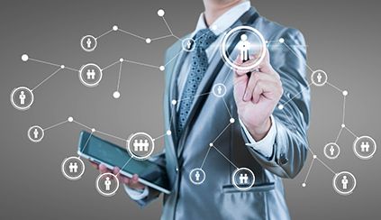 man in a suite with a tablet with illustration over people in circles connected by lines